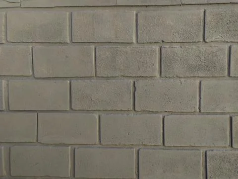 Gray wall background with bricks in horizontal format Stock Photos