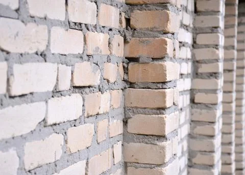 Gray wall of long bricks Stock Photos