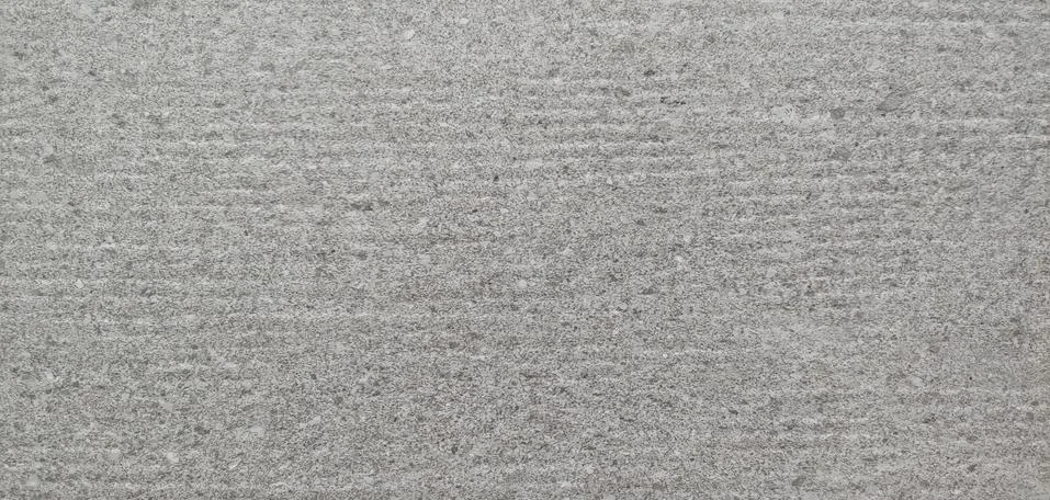 A gray wall with small horizontal lines visible background Stock Photos