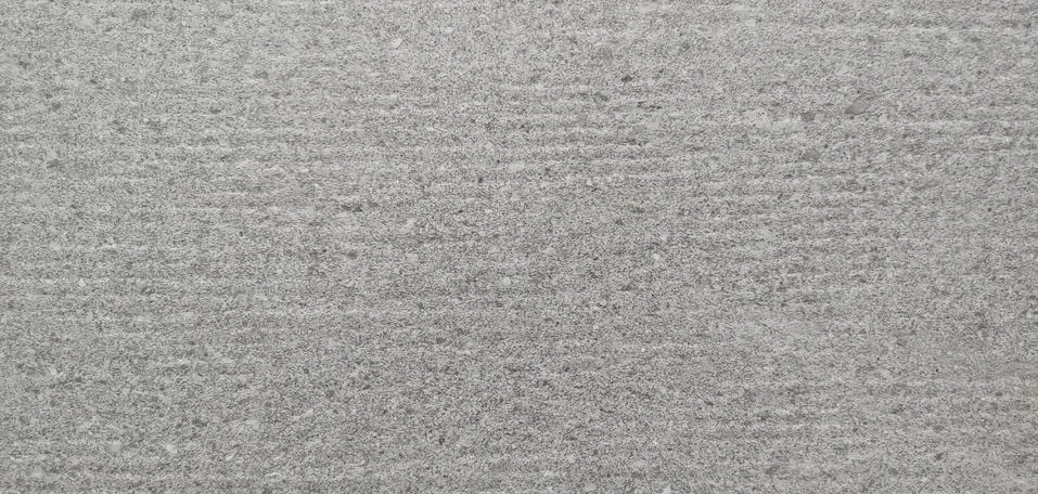 A gray wall with small horizontal lines visible background Stock Photos