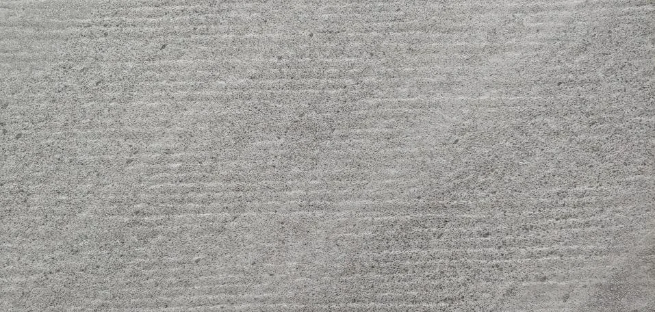 A gray wall with small horizontal lines visible background Stock Photos