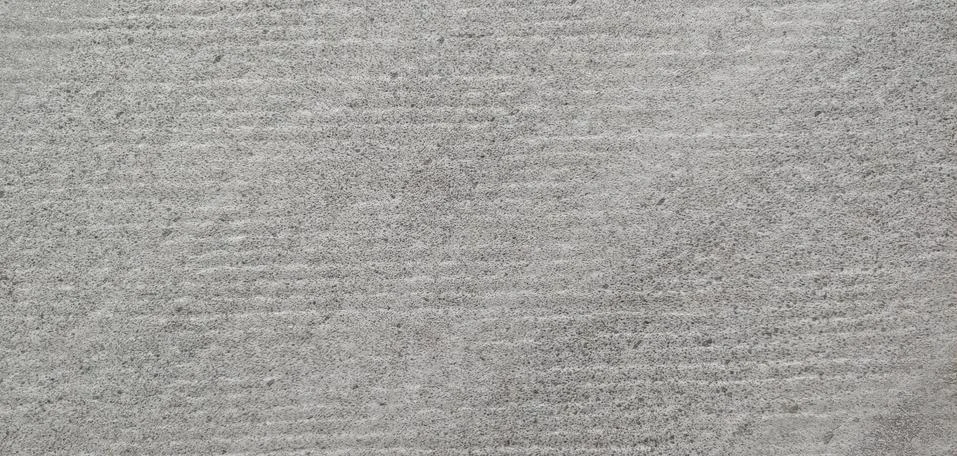 A gray wall with small horizontal lines visible background Stock Photos