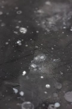 Gray wall with spots of paint. Decorative background. Stock Photos