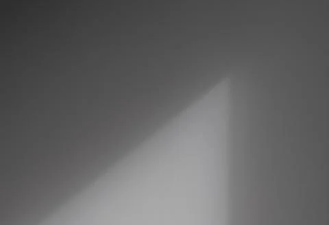 Gray wall texture background with natural window light shadow overlay. Minima Photos