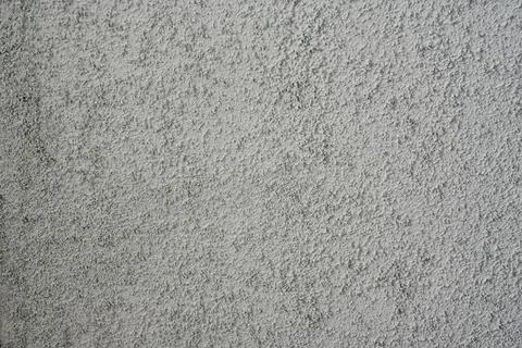 Gray wall texture. plaster orange peel on the wall Stock Photos