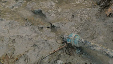 Gray waste liquid flows out of the pipe under high pressure Stock-Footage 122323178