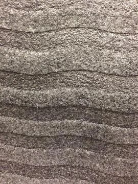 Gray wavy textured surface resembling fabric layers Stock Photos