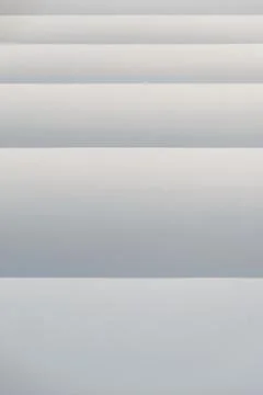 Gray-white background with horizontal gradient stripes. Stock Photos