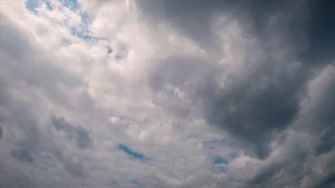 Gray white clouds floating across the blue sky Stock Footage 157930523