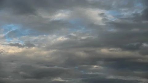 Gray, white, yellow and bluish clouds in multiple layers Stock Footage 140937199
