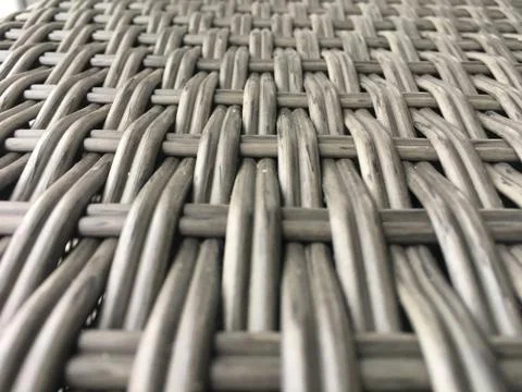 Gray wicker texture closeup. Background for website design, screen, banner. Stock Photos