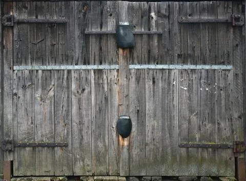 Gray wooden double door, old garage door, taupe boards Stock Photos