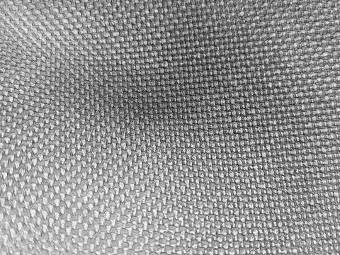 Gray woven fabric texture background with macro pattern Stockfoto's