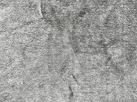 Gray woven fabric texture with subtle creases and soft light creating minimal Stock Photos