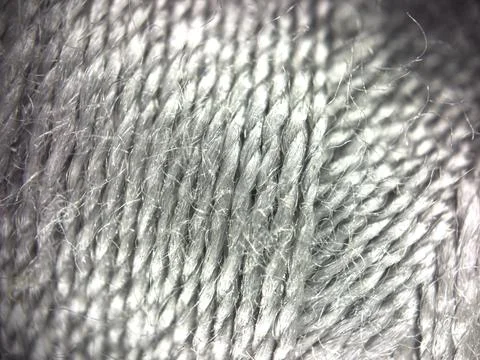 Gray yarn thread texture close up macro concept for knitting, textile industry, Stock Photos