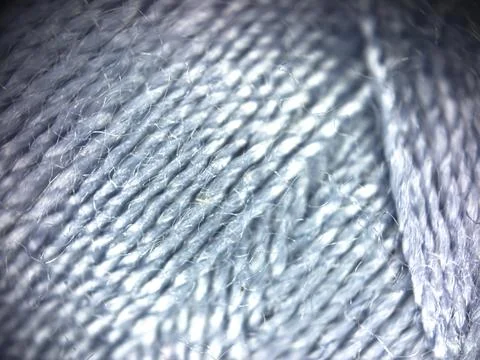 Gray yarn thread texture close up macro concept for knitting, textile industry, Stock Photos