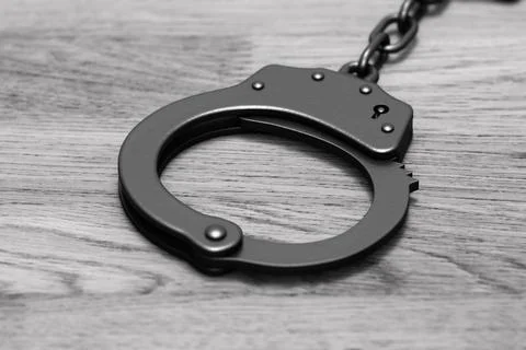 Grayscale 3D render: black locked police handcuffs Stock Illustration