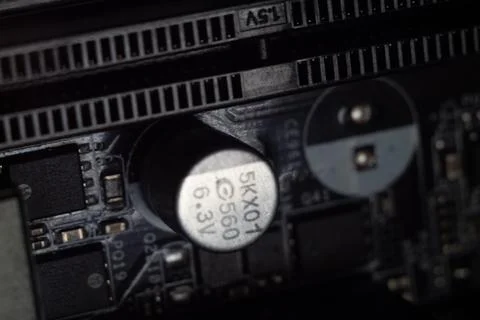 Grayscale shot of buttons and elements on a mobo 스톡 사진