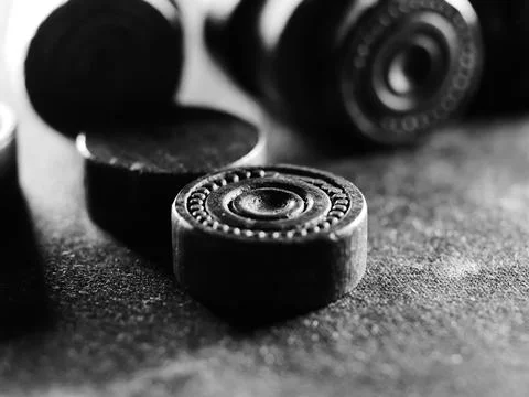 Grayscale studio shot of backgammon pieces Stock Photos