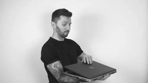 Grayscale video of a tattooed man questioning something and lifting up, opening Stock Footage 297195268