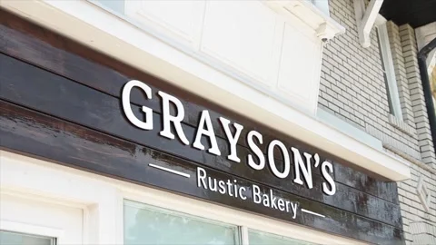 Graysons rustic bakery horizontal rectangle sign black white storefront store Stock Footage 251352717
