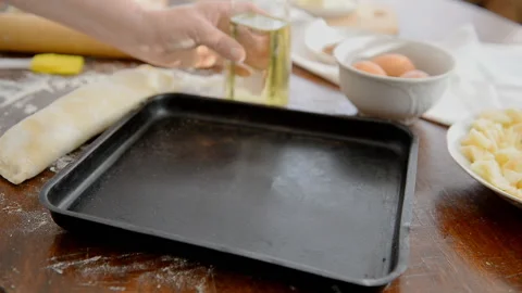 Grease the baking tray with oil. Stock Footage 101320965