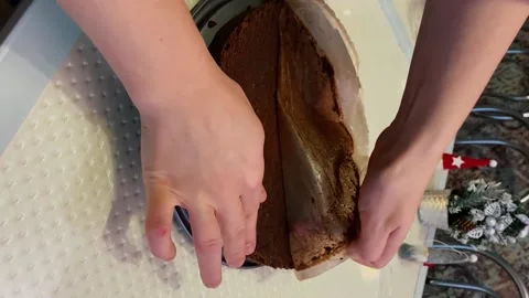 Grease-Proof Paper Being Removed From Sponge Cake Layers Stock Footage 167507028