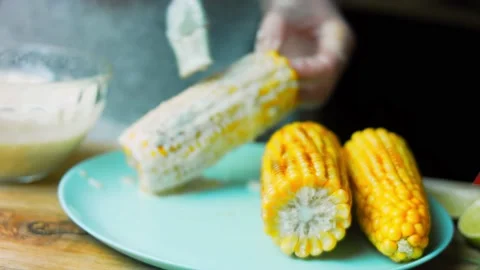 Grease with sauce three planted corn. Mexican corn elote in three ways Stock Footage 170429551