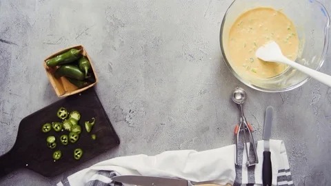  Greasing muffin pan for baking spicy jalapeno cornbread muffins. Stock Footage 97152262