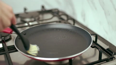 Greasing with oil a pan. Stock Footage 133595929