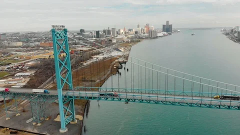 Great Aerial Pullback Trucks Crossing Bridge Downtown Detroit Stock Footage 100535243