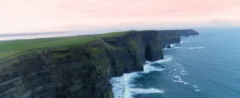 Great aerial shot of the Cliffs of Moher at the coast of Ireland. Waves against Stock Footage 127924596