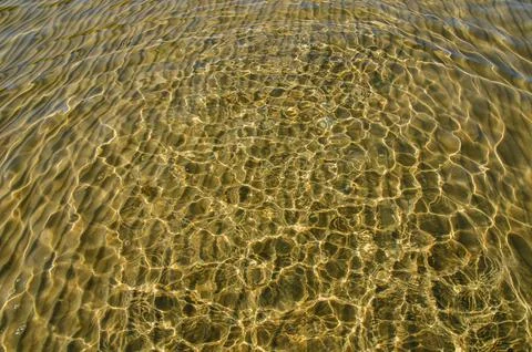 Great background whimsical patterns on the sand across the water horizontal Stock Photos