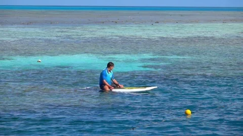 Great Barrier Reef, Corals Surfacing, Man on Surf, Slow Motion Stock-Footage 70499041