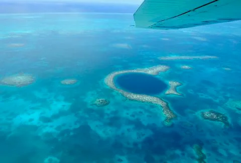 Great Blue Hole and Lighthouse Reef in Belize Stock Photos