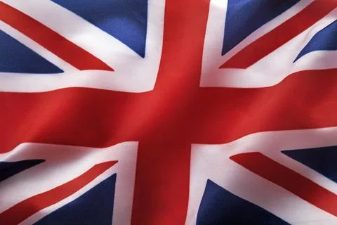 Great Britain flag with fabric structure waving in the wind Photos