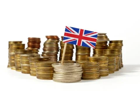 Great Britain flag waving with stack of money coins Stock Photos