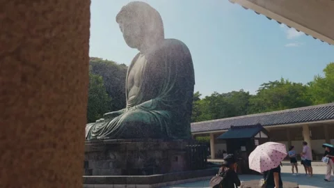 Great Buddha of Kamakura Revealed Through Cooling Water Mist in Japan Stock Footage 346104429