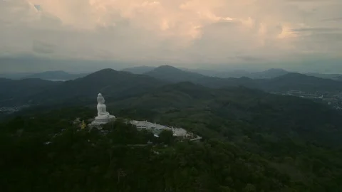Great Buddha of Phuket statue sitting calmly on hill top Stock Footage 314817875