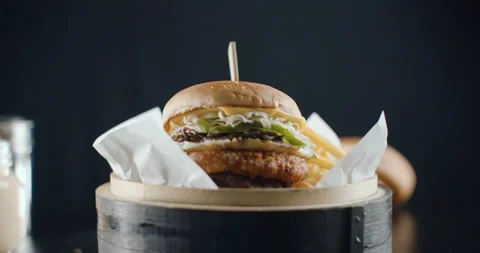 Great Burger with beef cutlet, cabbage, onion and cucumbers with french fries Stock Footage 102164668