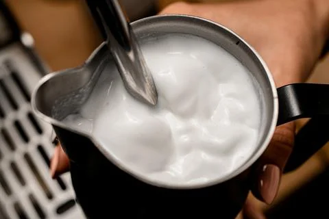 Great close-up view of fresh whipped foam of cream in jug Stock Photos