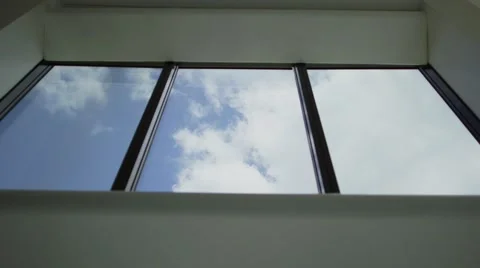 Great clouds passing with classic windows on foreground. Video stock 56030741