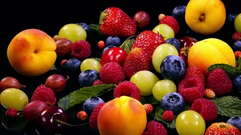 Great decorative background with mixed berries and fruits and mint leaves 4K Видео 78506015