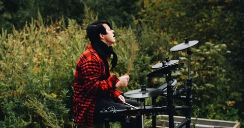Great drummer. The guy plays in the fresh air. Nice shots on the side. Stock Footage 114519874