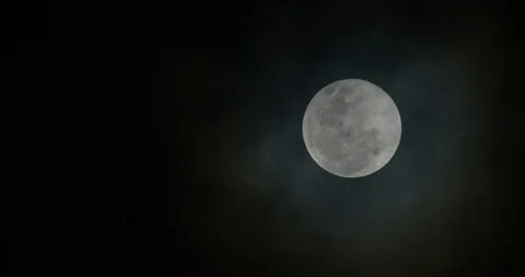 Great Full Moon Clouds Passing Fully Covering Moon Stock Footage