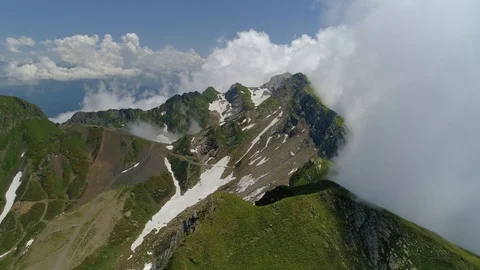 From great height epic highest mountains covered with white clouds nature Russia Stock Footage 122629869