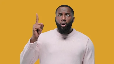 Great idea. African guy raised index finger up came up with great cool fresh Stock Footage 142584823