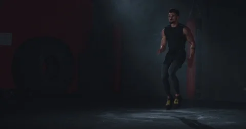 Great looking athletic guy have a jumping exercises in a cross fitness class he Video stock 116900915
