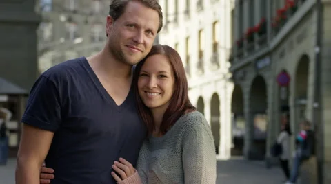 Great looking couple standing together in a beautiful Medieval city. Video stock 63022847