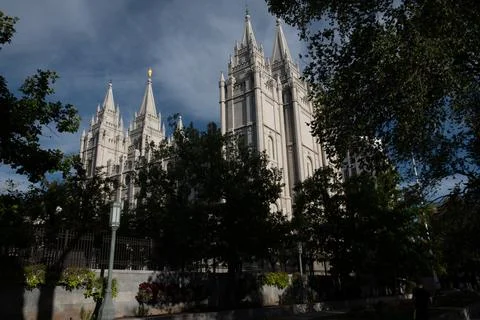 Great Mormon Temple through the trees on Temple Square, Salt Lake City, Utah Stock Photos